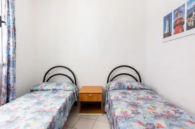 Letto o letti in una camera di GuestHost - Cozy Flat with Terrace by the Sea