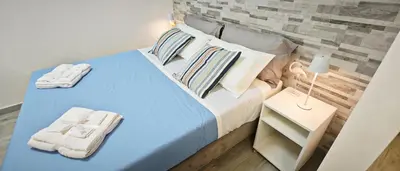 Letto o letti in una camera di Granello di Sabbia