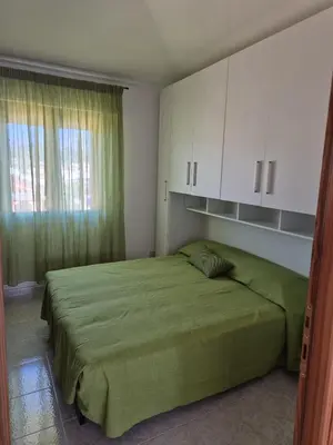 Letto o letti in una camera di Tortolì Centro