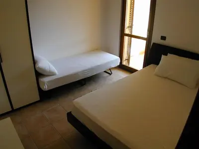 Letto o letti in una camera di Appartamento Markus By La Via Del Mare Viaggi e Vacanze