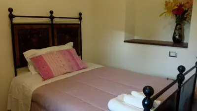 Letto o letti in una camera di Affittacamere Carpe Diem