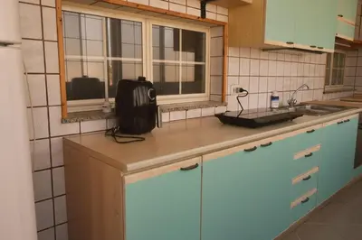 Cucina o angolo cottura di Elmas Family Apartment with Large Terrace Close to the Airport
