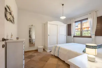 Letto o letti in una camera di Boutique Home- Modernità & Tradizione Sarda-5 minuti da spiagge e centro