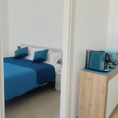 Letto o letti in una camera di Lera's apartments, bilocale luminoso e confortevole