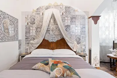 Letto o letti in una camera di Domo Antico Borgo