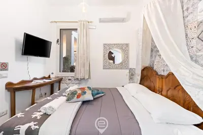 Letto o letti in una camera di Domo Antico Borgo