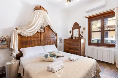 Letto o letti in una camera di Domo Antico Borgo