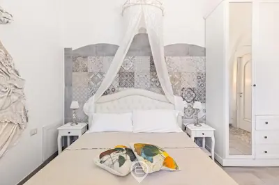 Letto o letti in una camera di Domo Antico Borgo