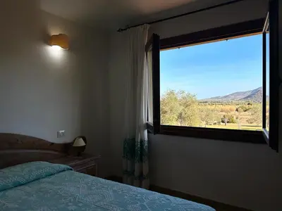 Letto o letti in una camera di Hotel I Menhirs