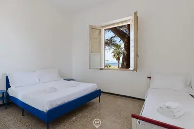 Letto o letti in una camera di Beachside Apartments - Vista