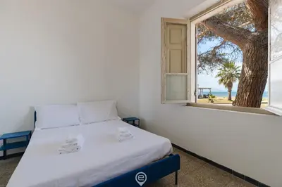 Letto o letti in una camera di Beachside Apartments - Vista