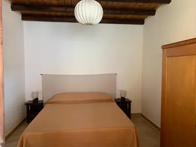 Letto o letti in una camera di Arega Rooms