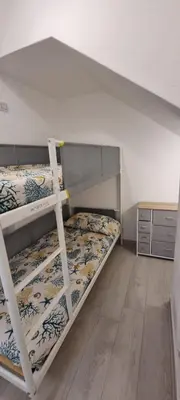 Letto o letti in una camera di Vacanze da Isidora a pochi passi dal mare