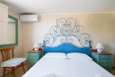 Letto o letti in una camera di Cagliari, Poetto - Steps from the Beach & Wi-Fi