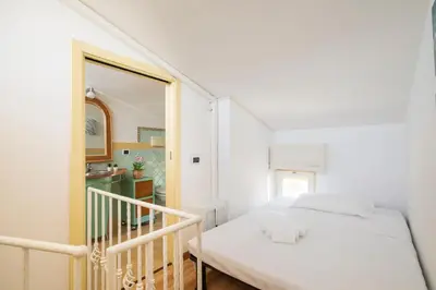 Letto o letti in una camera di Cagliari, Poetto - Steps from the Beach & Wi-Fi