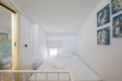 Letto o letti in una camera di Cagliari, Poetto - Steps from the Beach & Wi-Fi