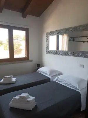 Letto o letti in una camera di Villa Olga