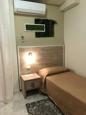 Letto o letti in una camera di Hotel Centrale