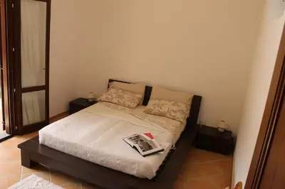 Letto o letti in una camera di Casa Alessandra