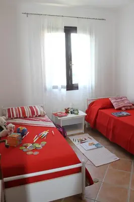 Letto o letti in una camera di Casa Alessandra