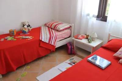 Letto o letti in una camera di Casa Alessandra