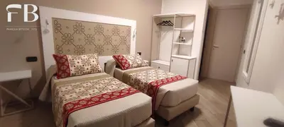 Letto o letti in una camera di Rooms FB Famiglia Bittu