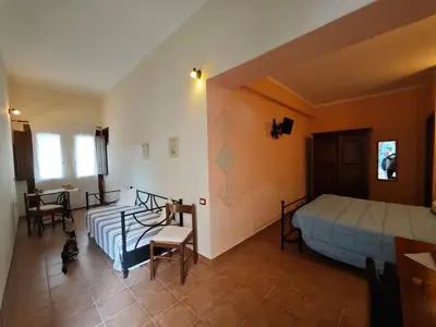 Letto o letti in una camera di B&B Domu Delunas