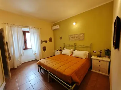 Letto o letti in una camera di B&B Domu Delunas
