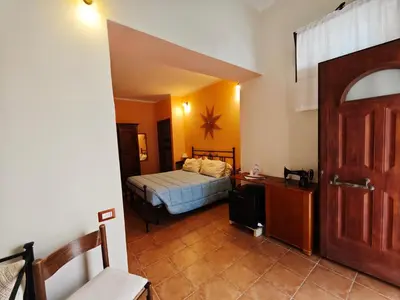 Letto o letti in una camera di B&B Domu Delunas