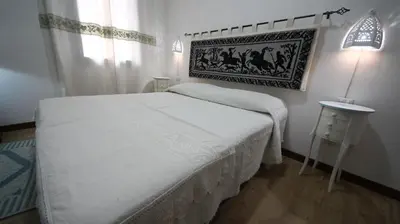 Letto o letti in una camera di Affittacamere Sa Mariola