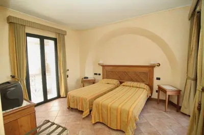 Letto o letti in una camera di Hotel Belvedere