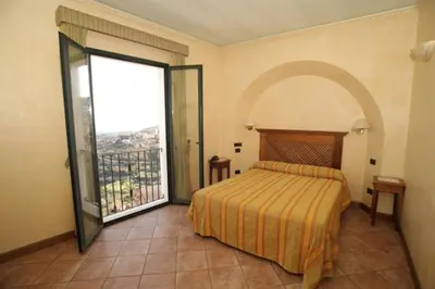 Letto o letti in una camera di Hotel Belvedere
