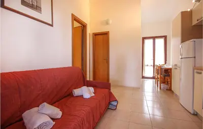 Area soggiorno di Awesome Apartment In Costa Rei -Ca-