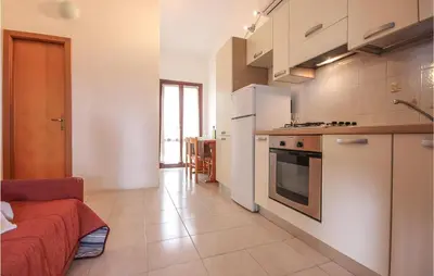 Cucina o angolo cottura di Awesome Apartment In Costa Rei -Ca-