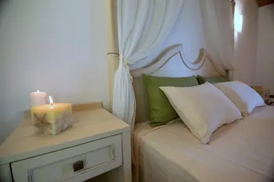 Letto o letti in una camera di Le Anfore Hotel