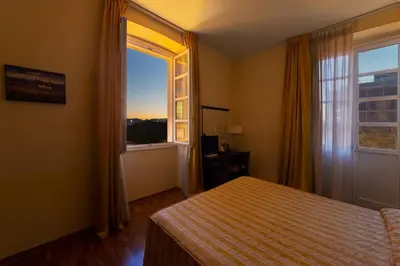 Letto o letti in una camera di Hotel Due Colonne