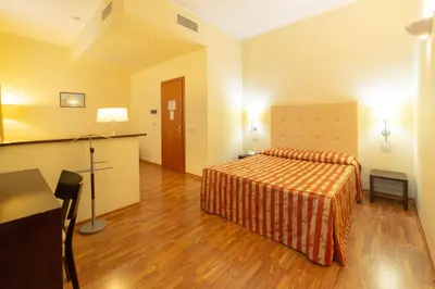 Letto o letti in una camera di Hotel Due Colonne