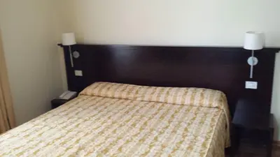 Letto o letti in una camera di Hotel Due Colonne