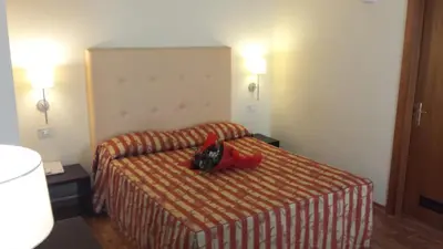 Letto o letti in una camera di Hotel Due Colonne