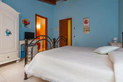 Letto o letti in una camera di La Capinera