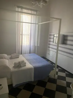 Letto o letti in una camera di Manì Rooms