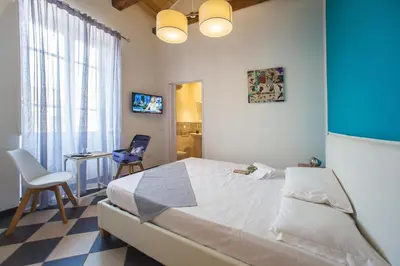 Letto o letti in una camera di Manì Rooms