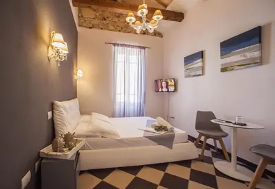 Letto o letti in una camera di Manì Rooms