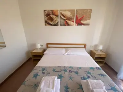 Letto o letti in una camera di Lemon Apartments