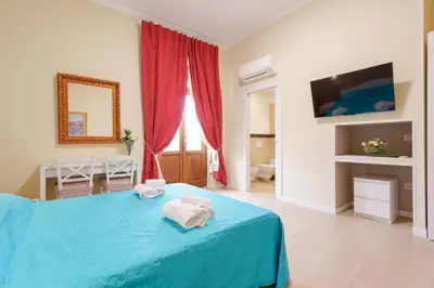 Letto o letti in una camera di Affittacamere 5 Stelle