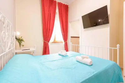 Letto o letti in una camera di Affittacamere 5 Stelle