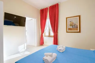Letto o letti in una camera di Affittacamere 5 Stelle