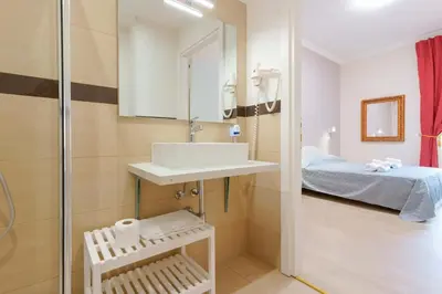 Letto o letti in una camera di Affittacamere 5 Stelle