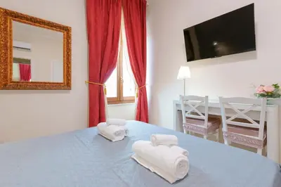 Letto o letti in una camera di Affittacamere 5 Stelle