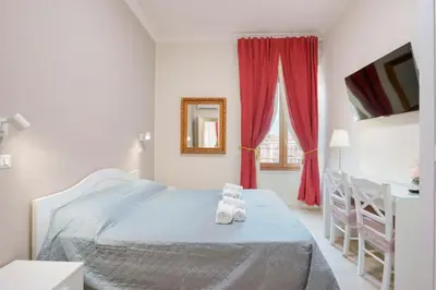 Letto o letti in una camera di Affittacamere 5 Stelle